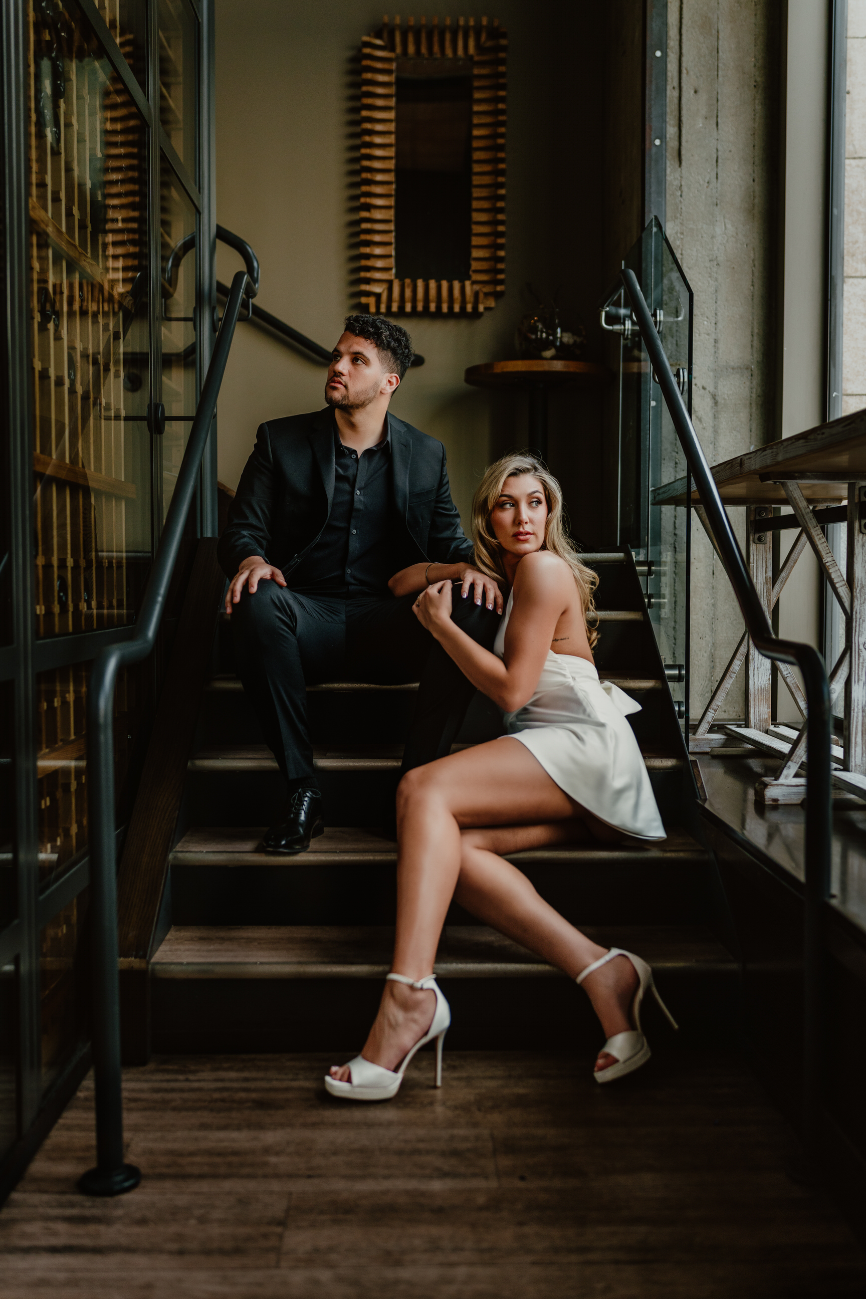 Couple sitting on staircase - photo by Sacramento wedding photographer As the Crow Flies