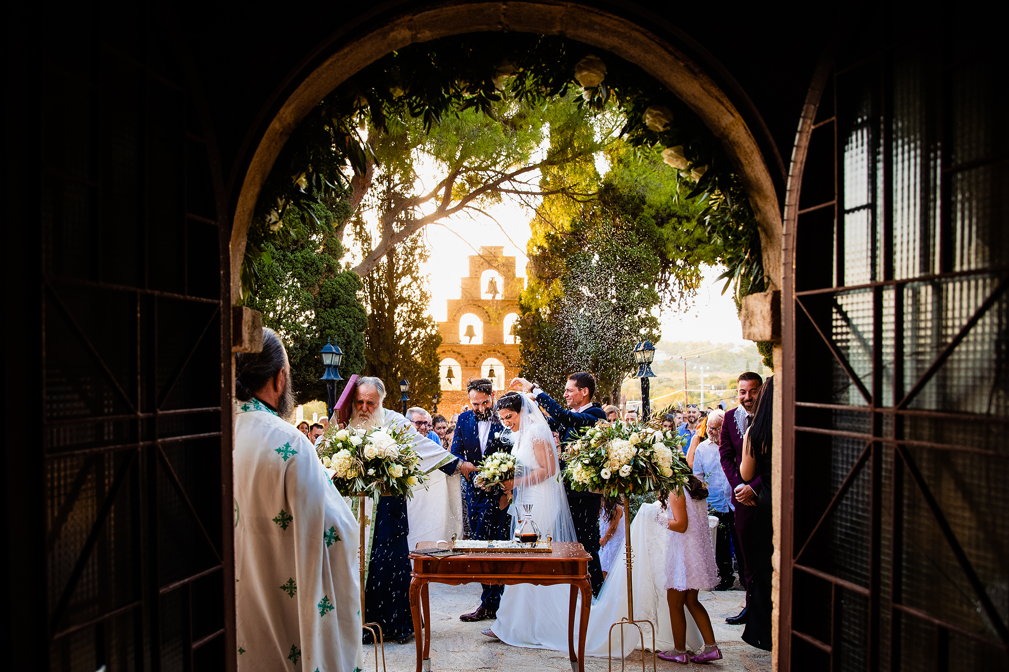 Wedding ceremony framed through church door - photo by Greece wedding photographer Dimi & Wallace Wedding ceremony framed through church door - photo by Greece wedding photographer Dimi & Wallace