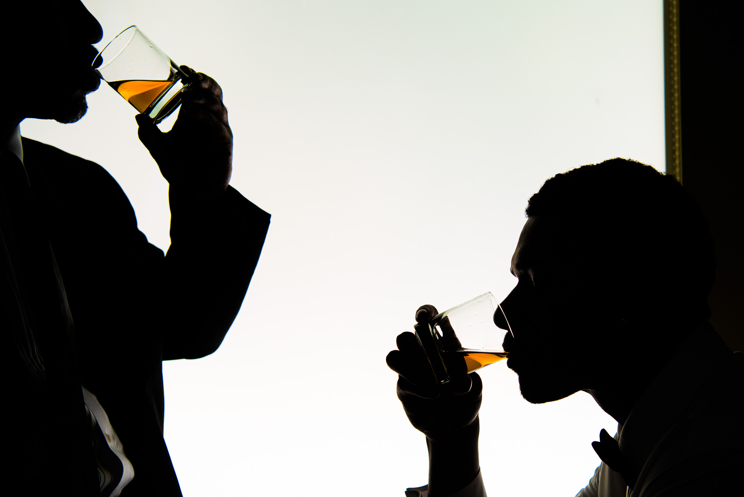Silhouette of men drinking whiskeys - photo by LA wedding photographer CALLAWAY GABLE Silhouette of men drinking whiskeys - photo by LA wedding photographer CALLAWAY GABLE