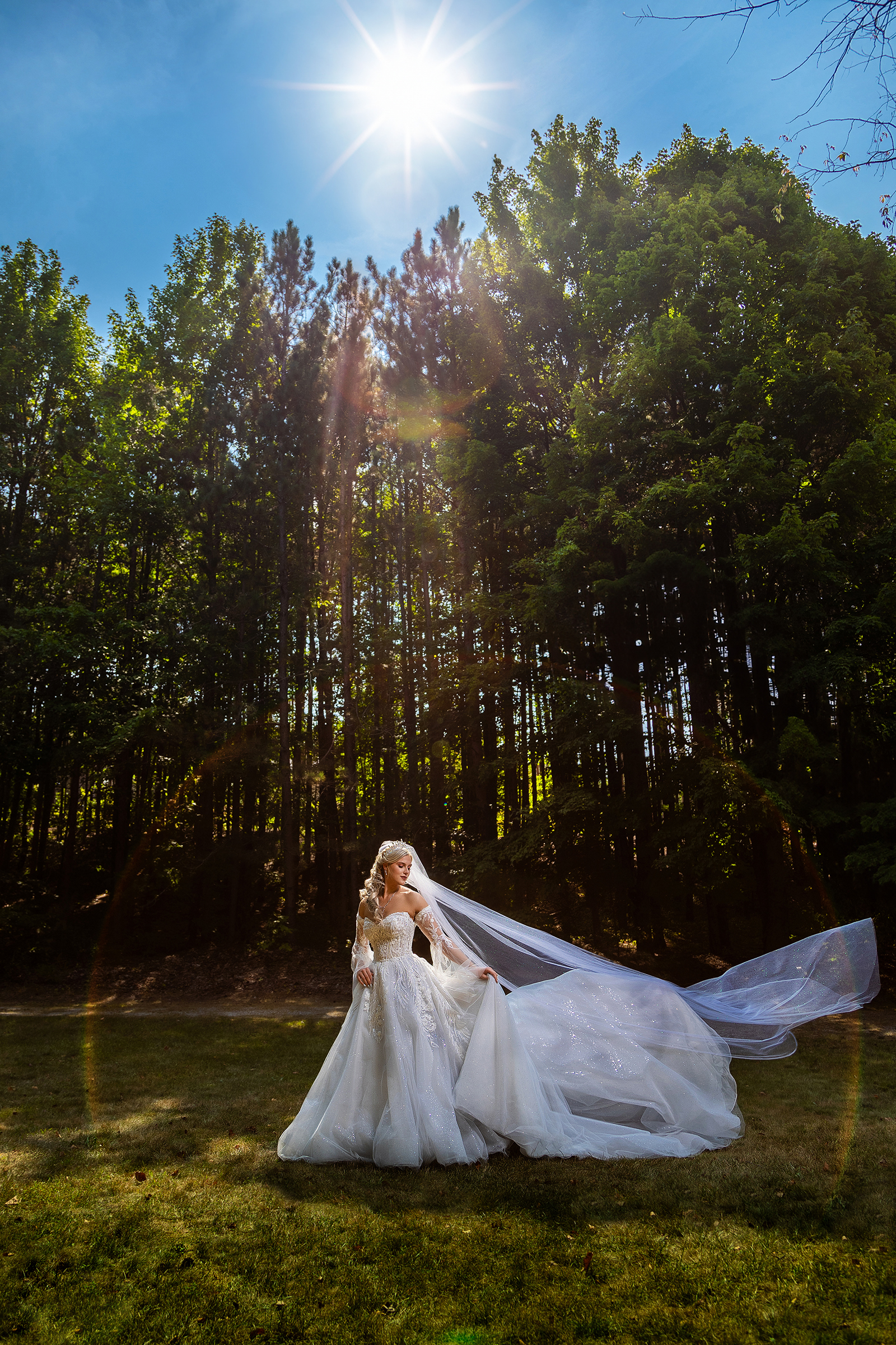 Bride in sun flare - photo by Amber Henry Photography