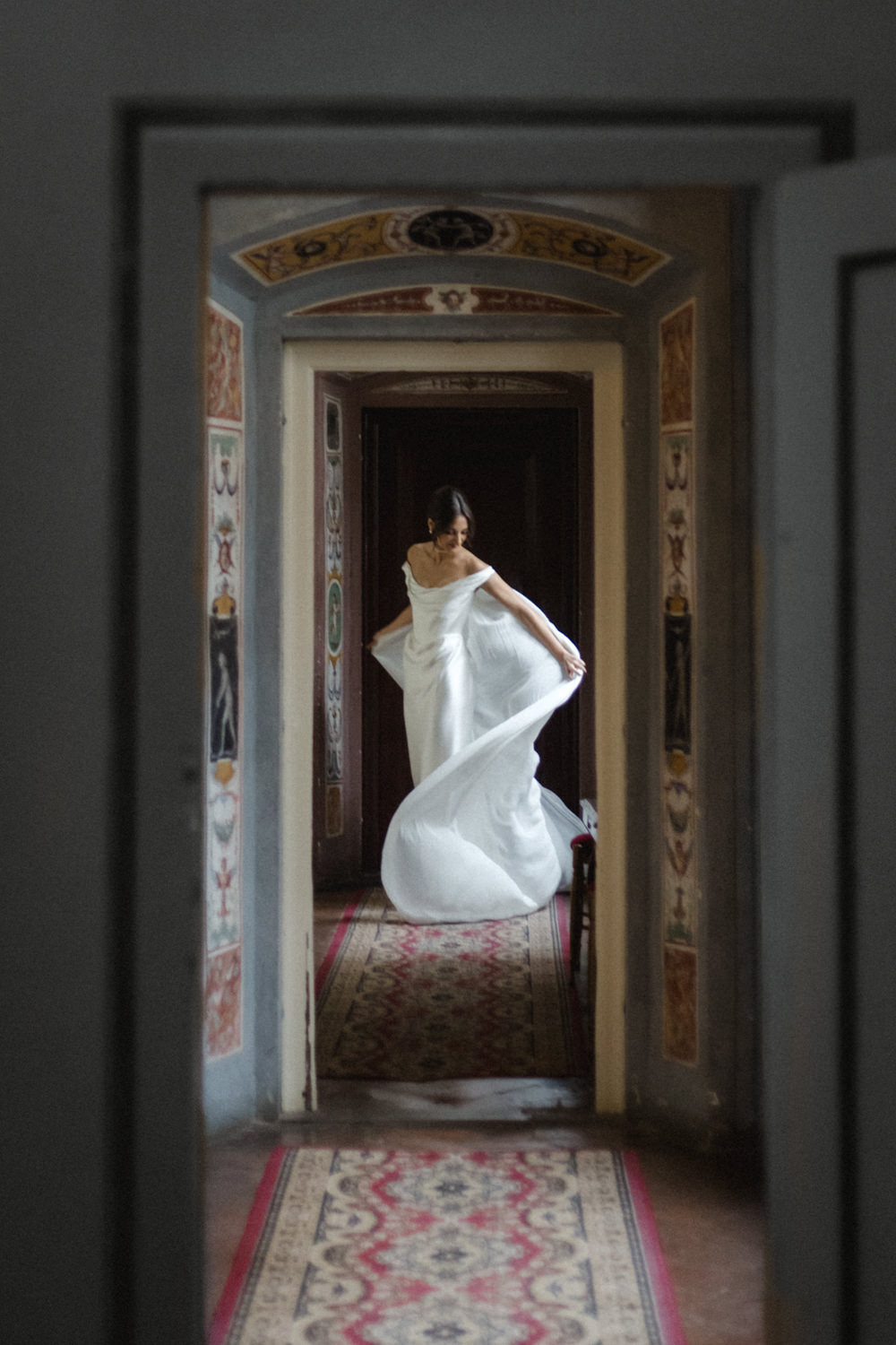 Bride swishing her gown - photo by Laura Barbera Photography