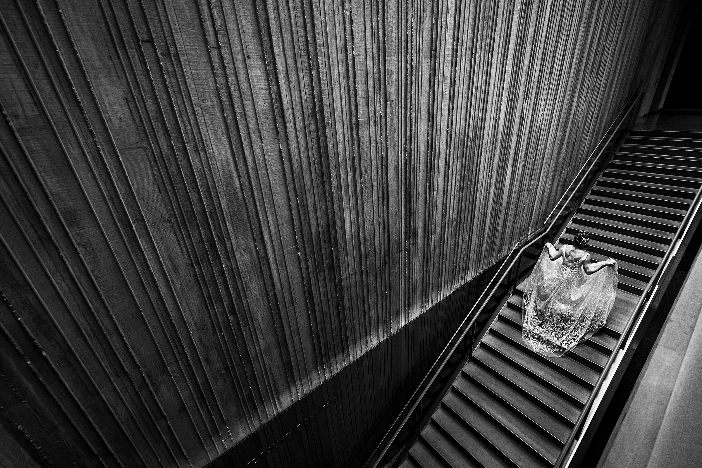 Bride ascending dramatic stairs - photo by J. La Plante Photo