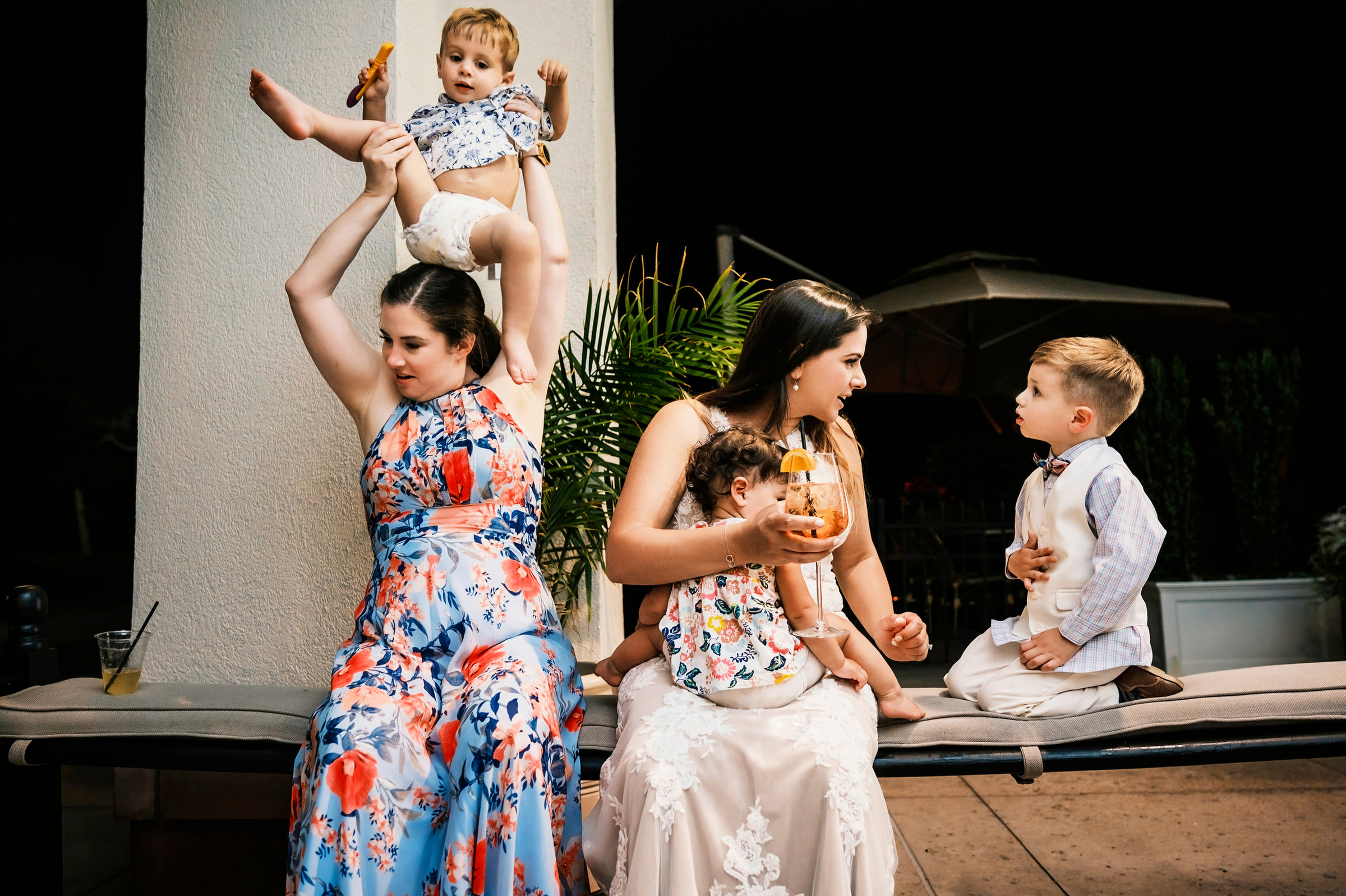 Bride hanging out with kids - photo by Chrisman Studios