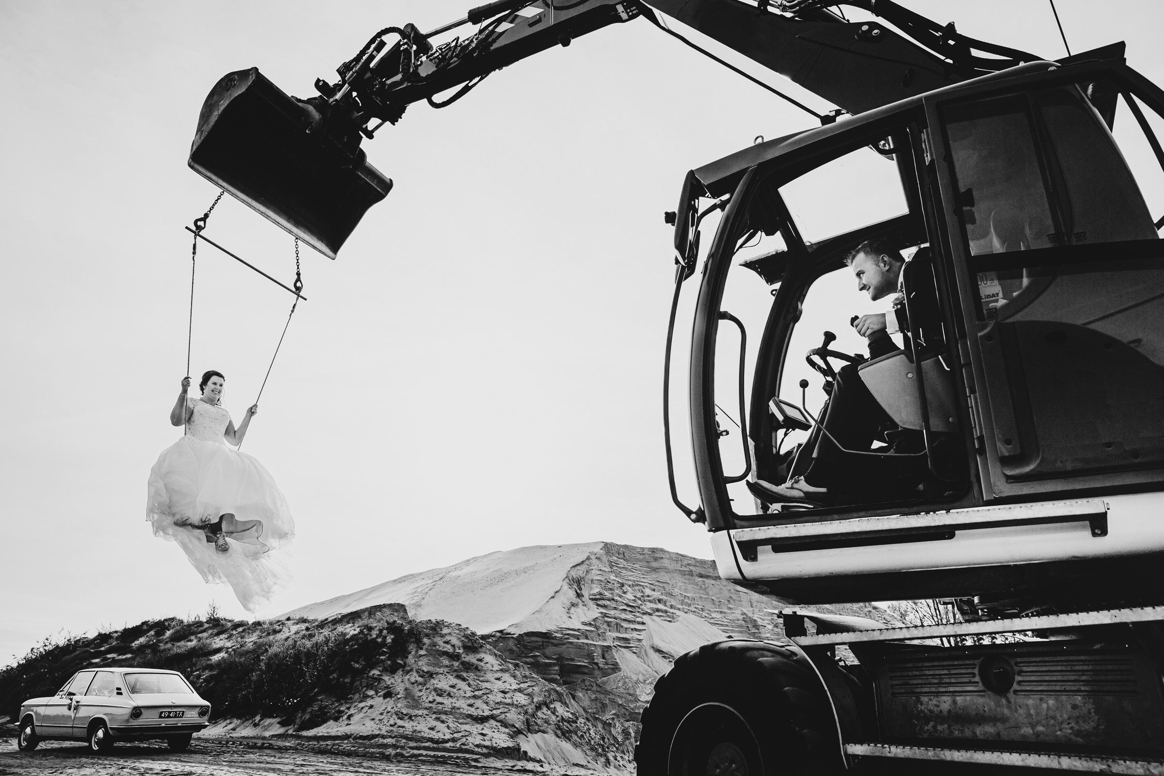 Bride on crane driven by groom - photo by Peter van der Lingen 