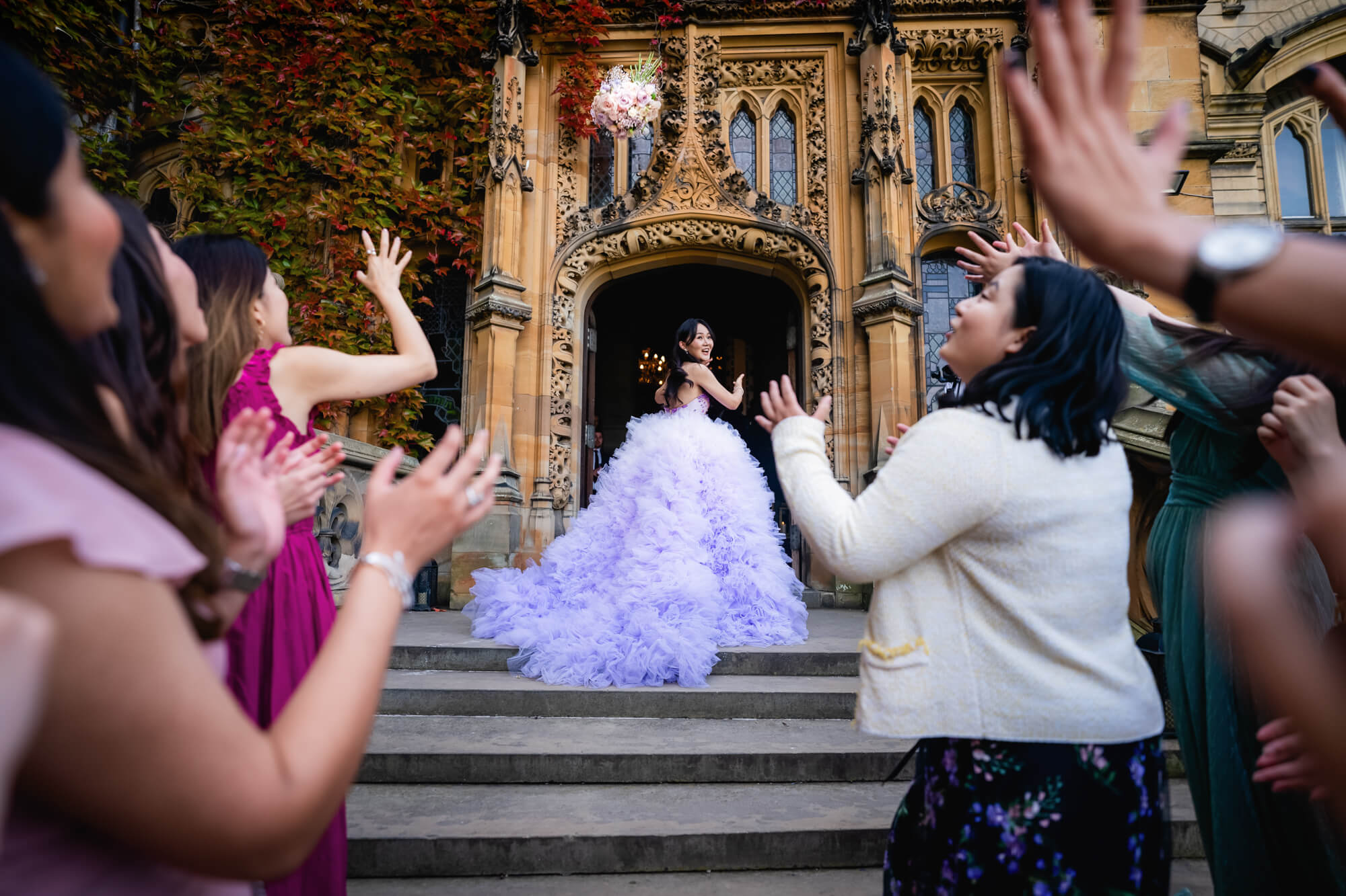 Bouquet toss on steps - photo by Kirsty Mattsson Photography