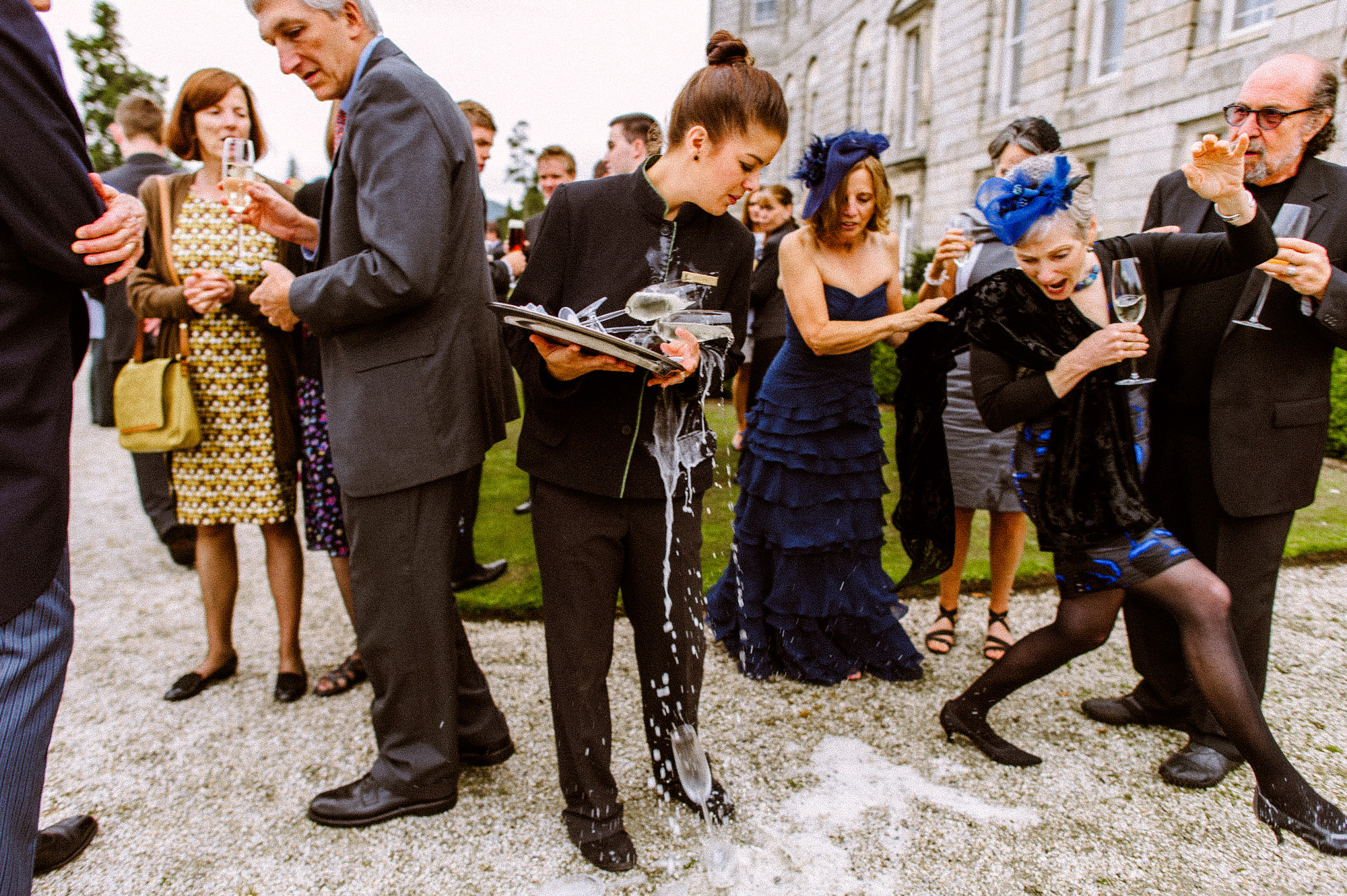 Champagne spilling at cocktail hour- photo by Ireland documentary wedding photographer Aspect Photography 