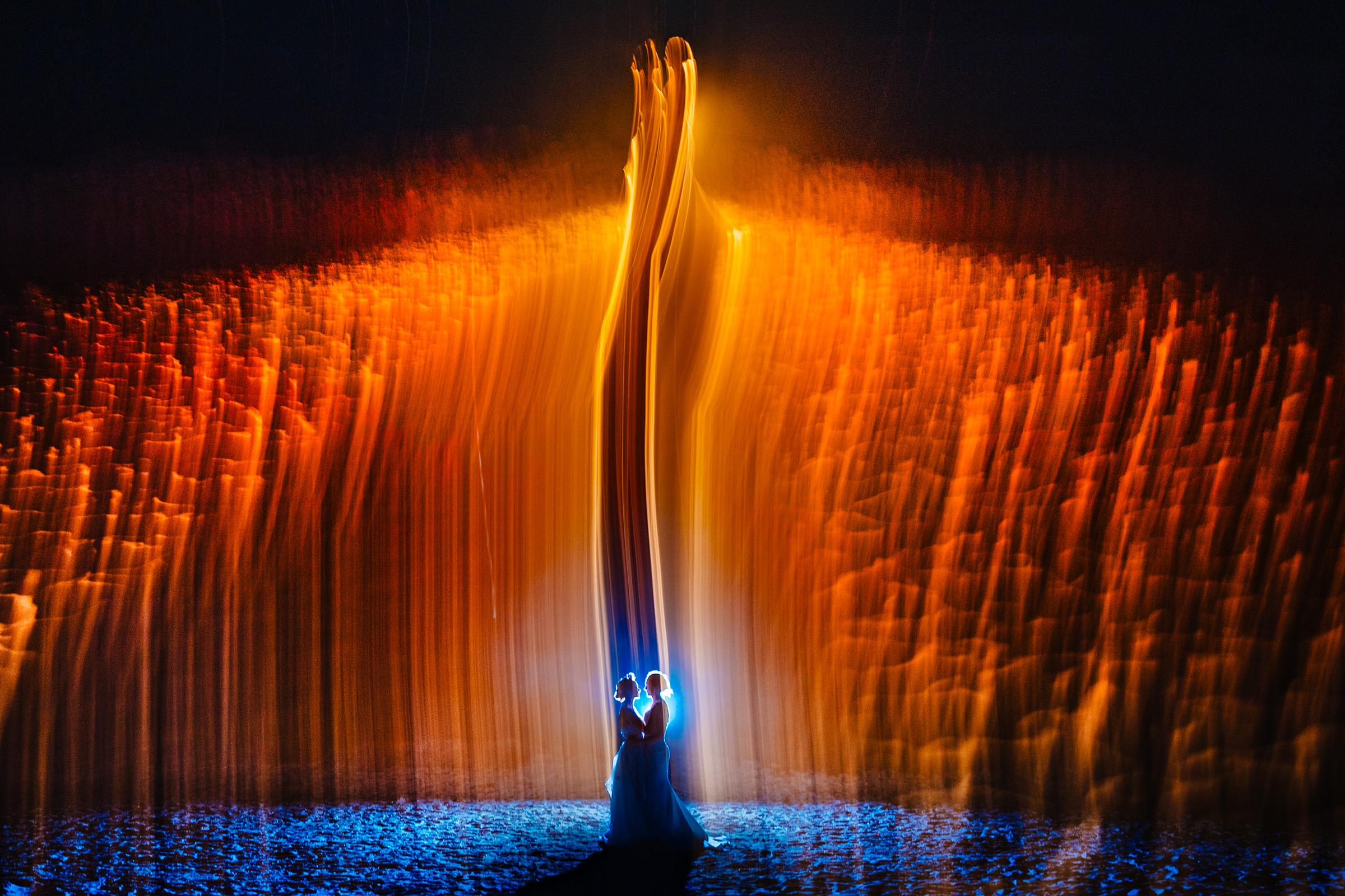 Brides under the fire, photo by Vinson Images, Arkansas wedding photographers