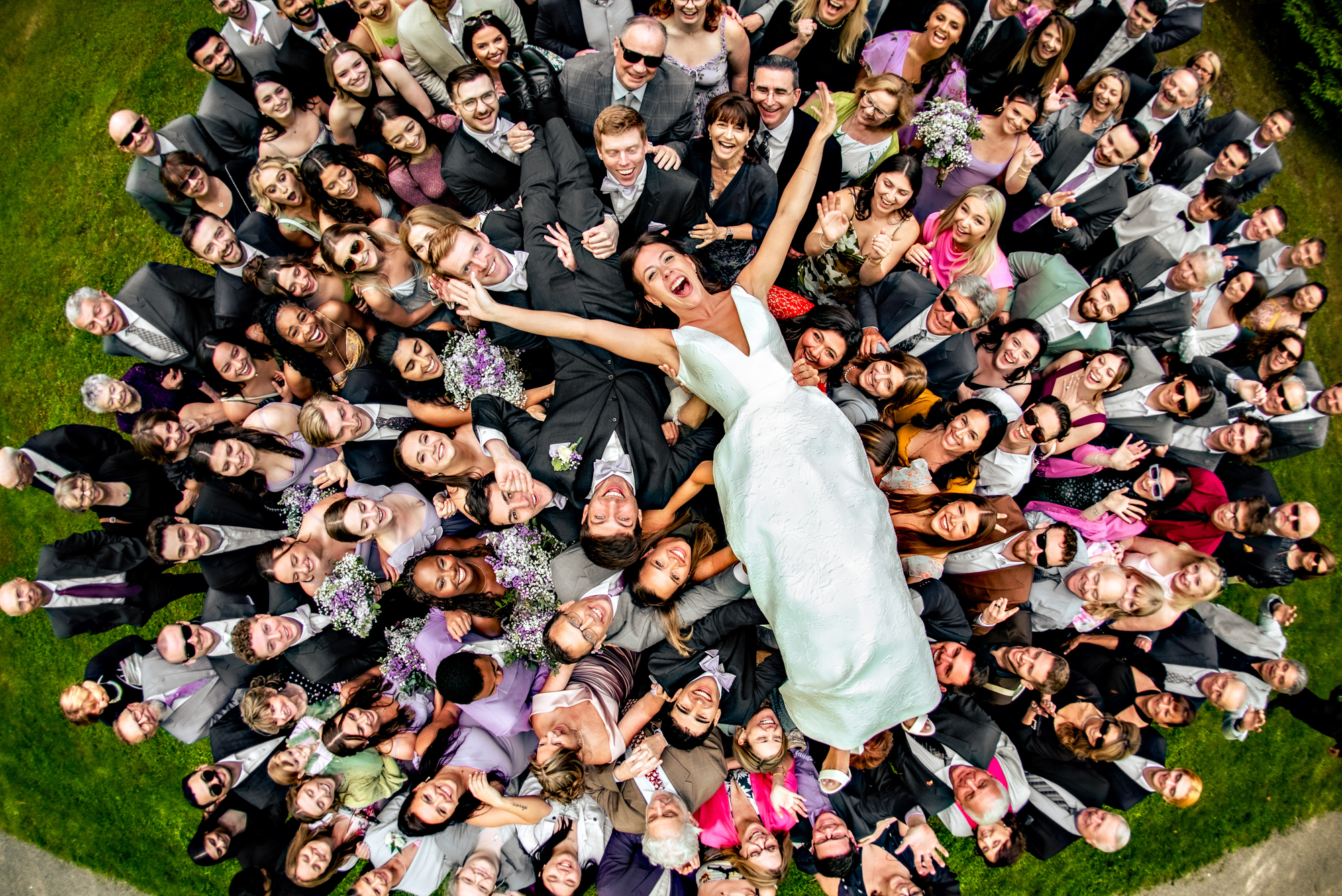 Couple crowdsurfs on guests, photo by Jeff Tisman Photography, New Yok wedding photographers