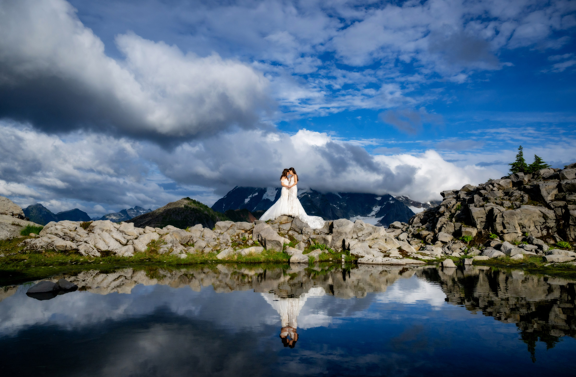 Brides on the mountainous waterfront, photo by Aralani Photography, Oregon wedding photographers