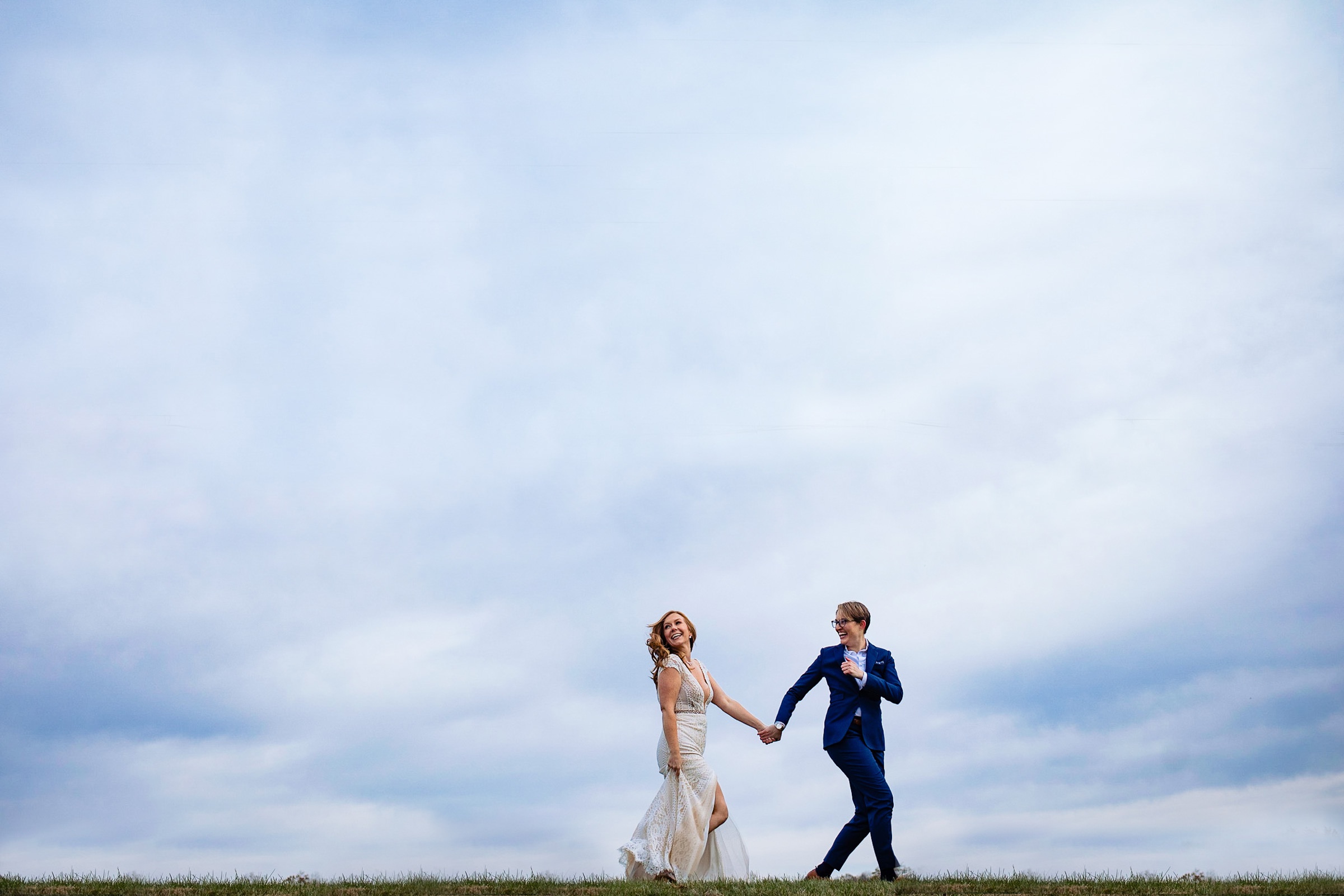 Brides against blue skies - photo by Photography by Brea