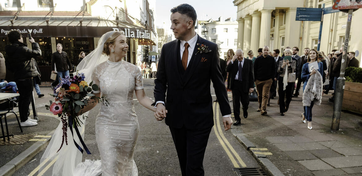 Couple walking on street Brighton Town Hall wedding Oliver Holder Photography Bristol Wedding Photographer