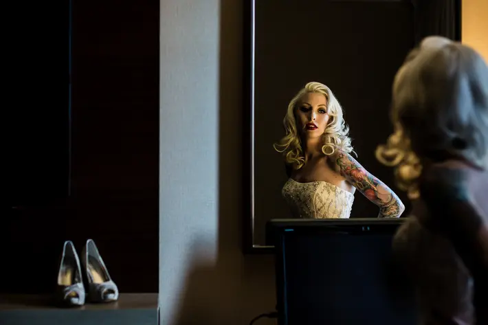 Glamorous bride with tatoos - photo by JAG Studios 