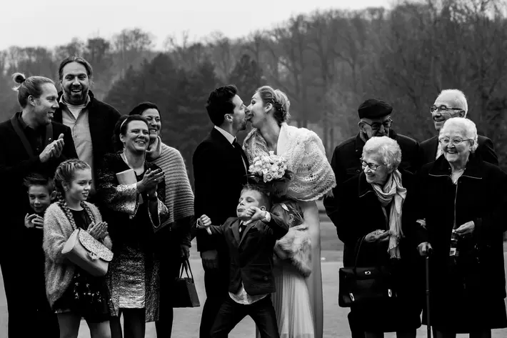 Boy gives thumbs down to ceremony kiss - photo by Fotobelle
