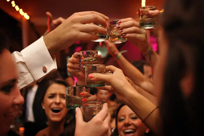 Guest put their drinks up at wedding reception - photo by Daniel Aguilar