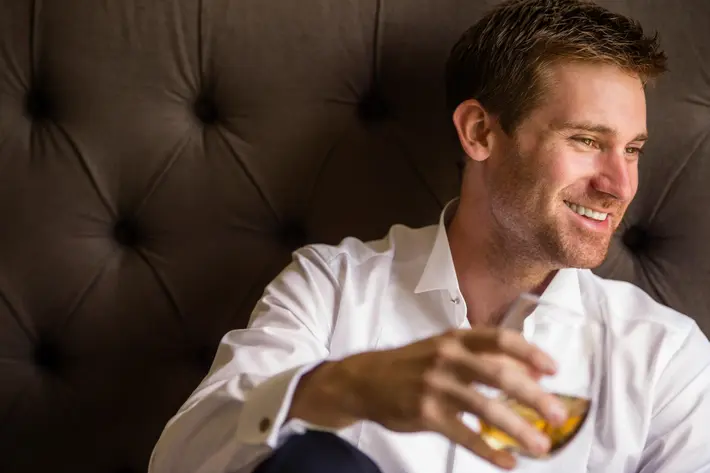 handsome-groom-with-glass-of-scotch-wedding-photos-jerry-ghionis