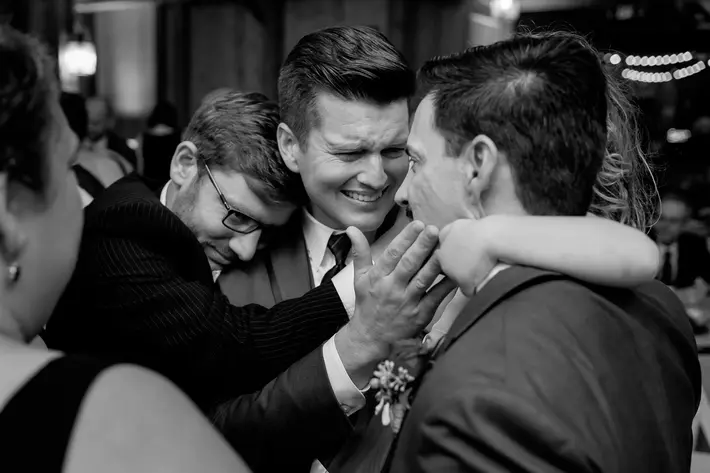 black-and-white-group-hug-groomsmen-worlds-best-wedding-photos-tyler-wirken-kansas-city-wedding-photographers
