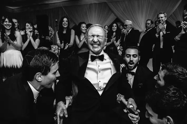Father prepares for Hora dance - photo by Callway Gable