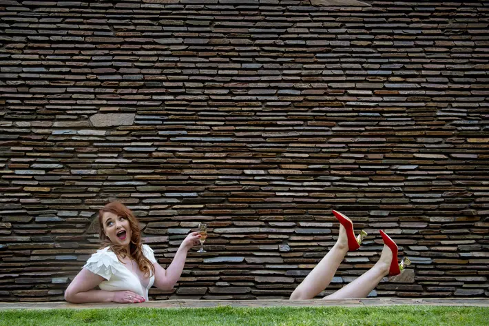 funny-composition-of-bride-and-friend-wearing-red-shoes-by-jacki-bruniquel