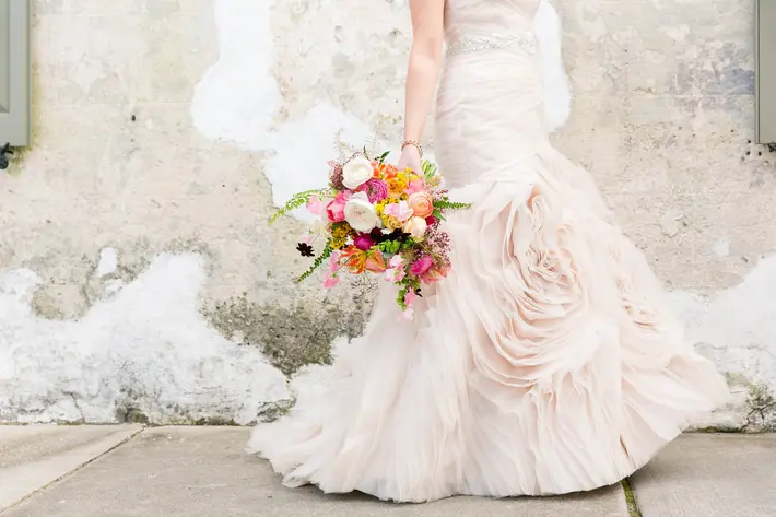 blush-bridal-gown-with-rose-shaped-ruffled-detail-dana-cubbage-weddings