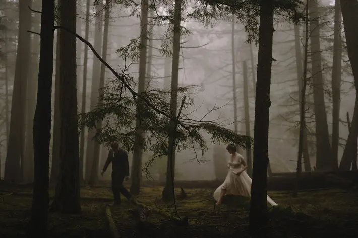 Ethereal photo of wedding couple walking through the woods at Mt. Constitution - Kristen Marie Parker