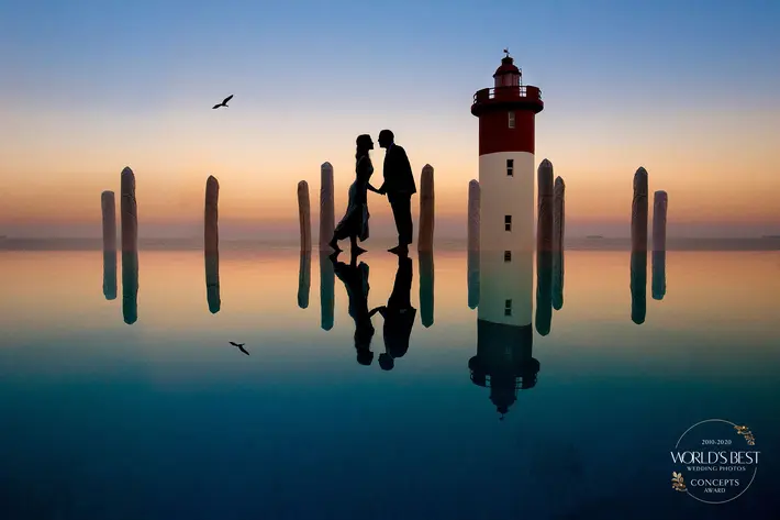 Silhouette of couple at lighthouse by Jacki Bruniquel - South Africa