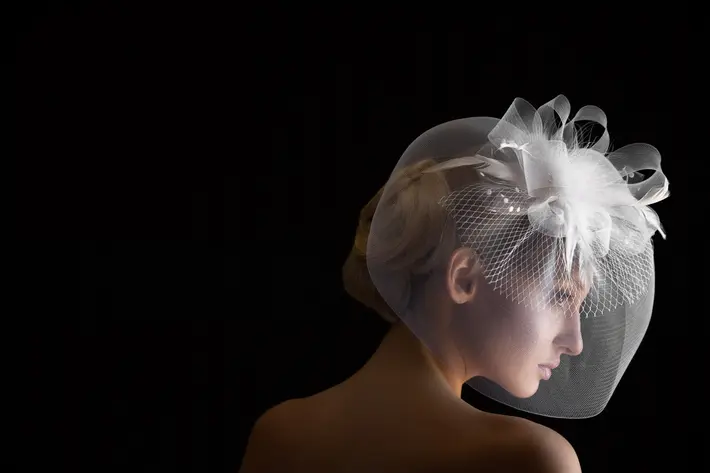 Bride in ribboned birdcage wedding veil - photo by Jerry Ghionis - Las Vegas