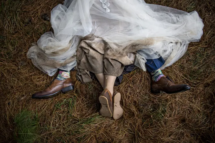 Bride and groom on barn floor - photo by Jacki Bruniquel