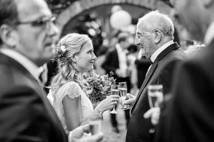 Bride and grandfather share tearful smiles and wedding reception - photo by Sylvain Bouzat - France