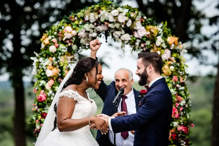 bride-and-groom-pronounced-husband-and-wife-joyfully-photo-by-hannah-photography