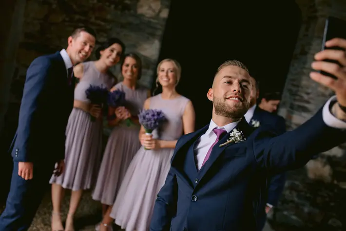 groomsman-taking-a-selfie-with-others-the-portrait-rooms