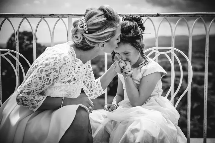 bride-kisses-little-girl-julien-laurent-georges