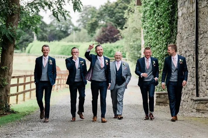 groomsmen-and-father-on-country-road-ireland-the-portrait-rooms