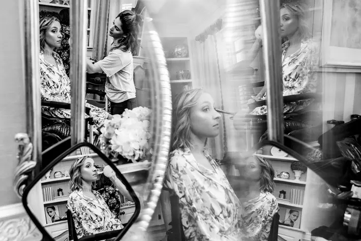 multiple-reflections-of-bride-having-makeup-applied-jeff-tisman-photography