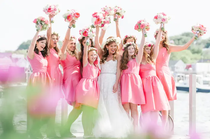 bouquets-in-the-air-for-bride-with-bridesmaids-and-flower-girls-zofia-co-photography