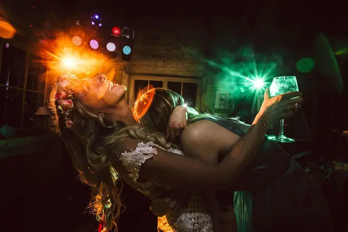 Bride and guest dancing by FineArt Weddings Photography from Germany