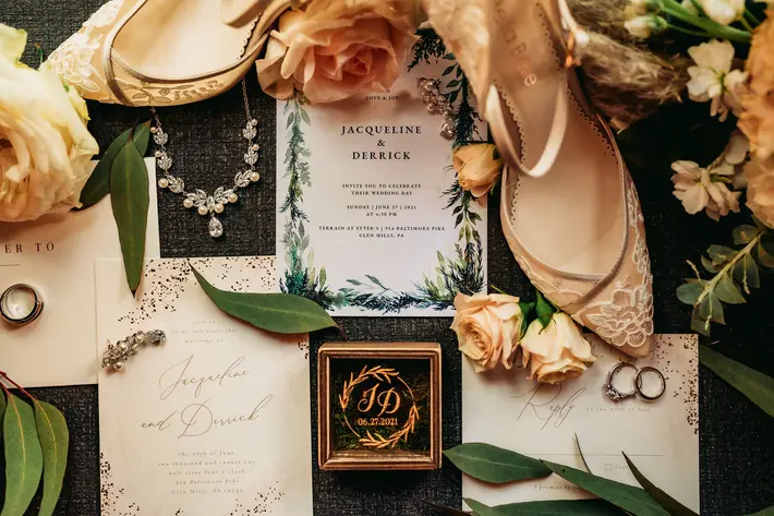 flat-lay-with-shoes-stationery-rings-and-flowers-mike-zawadzki-photography