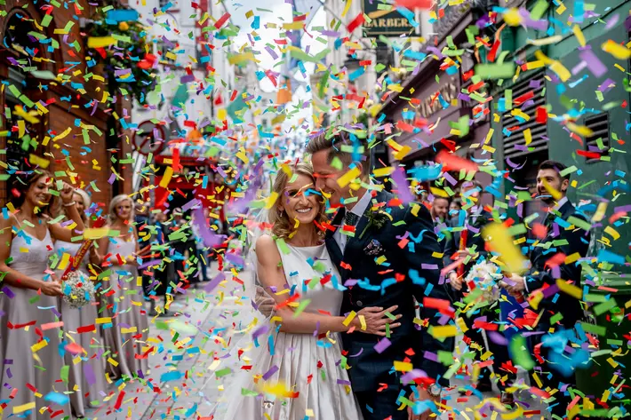 ouple-exit-amid-big-colorful-confetti-john-gillooley