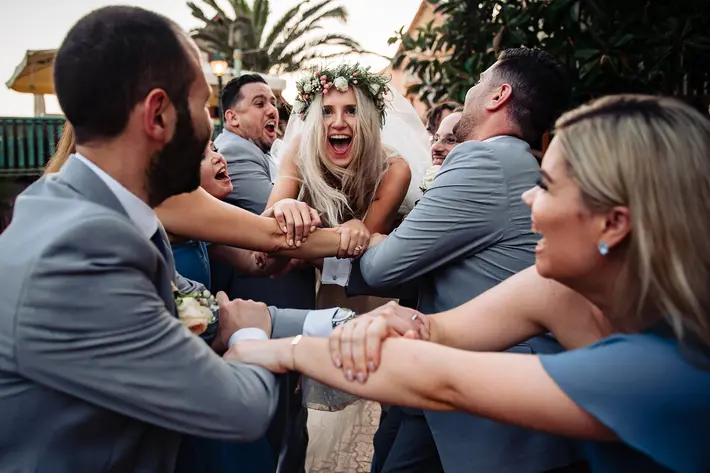bride-happily-jumping-into-the-arms-of-her-guests-photo-by-shane-p-watts-photography