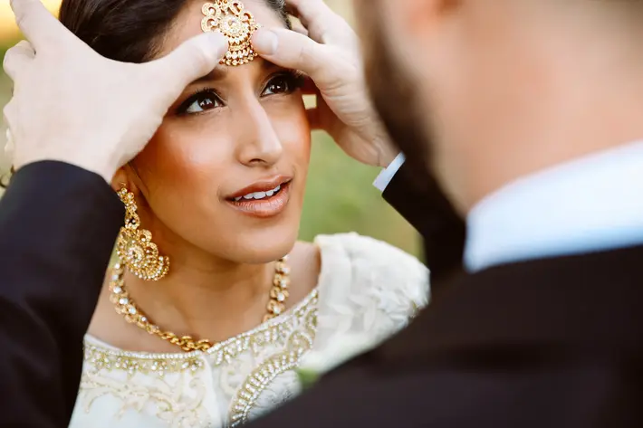 gold-maang-tikka-held-to-brides-head-worlds-best-wedding-photos-jessica-hill-portland-wedding-photographers