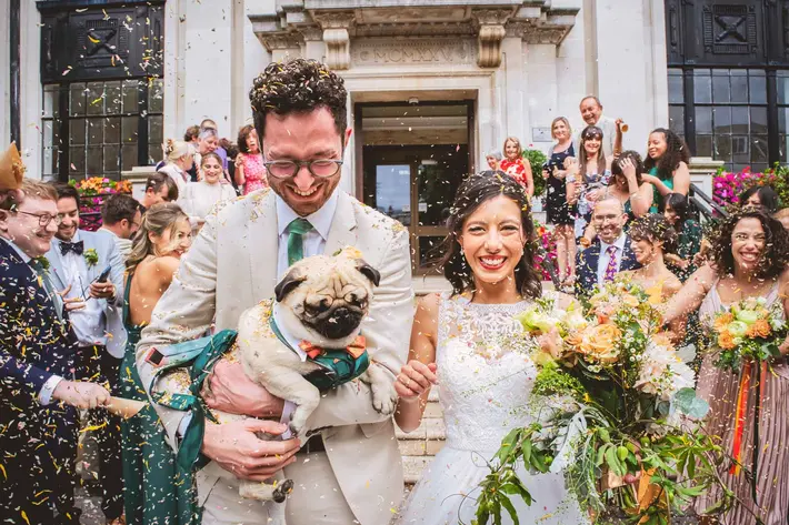 just-married-couple-leaving-chruch-with-pug-andrew-billington-photography