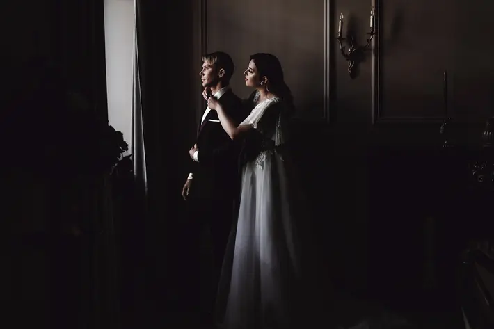 wedding-couple-at-window-photo-by-laura-zyge-photography