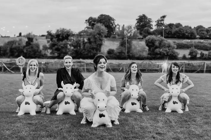 funny-photo-of-bride-and-bridesmaids-riding-blow-up-bulls-john-gillooley-ireland