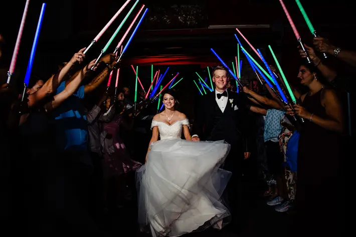 elegant-couple-exit-through-colorful-light-sabers-by-tiffany-hofeldt-photography