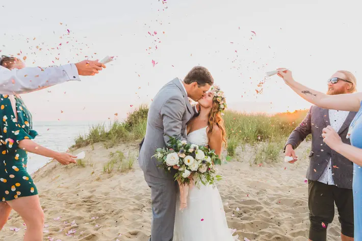 ceremonial-couple-kiss-under-confetti-katie-kaizer-photography