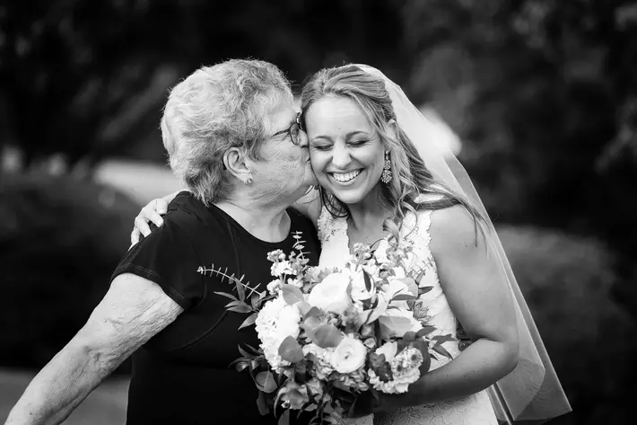 mom-kisses-smiling-bride-on-her-cheek-photo-by-fuller-photography-pa