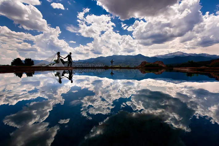 big-sky-landscape-reflected-with-hand-in-hand-couple-photo-by-j-la-plante-photo