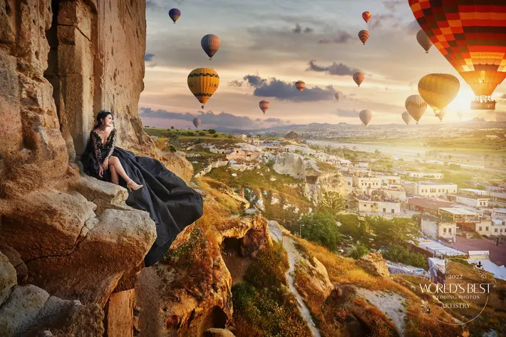 Cappadocia-Turkey-ballon-festival-bride-in-black-gown-on-cliff-hot-air-balloons-worlds-best-wedding-photos-cm-leung-china-wedding-photographers