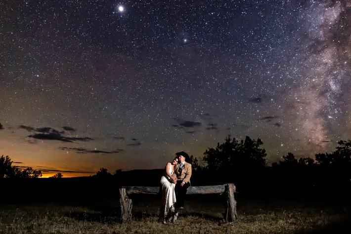 late-sunset-seated-couple-at-hitching-post-in-arizona-photo-by-talitha-tarro-photography
