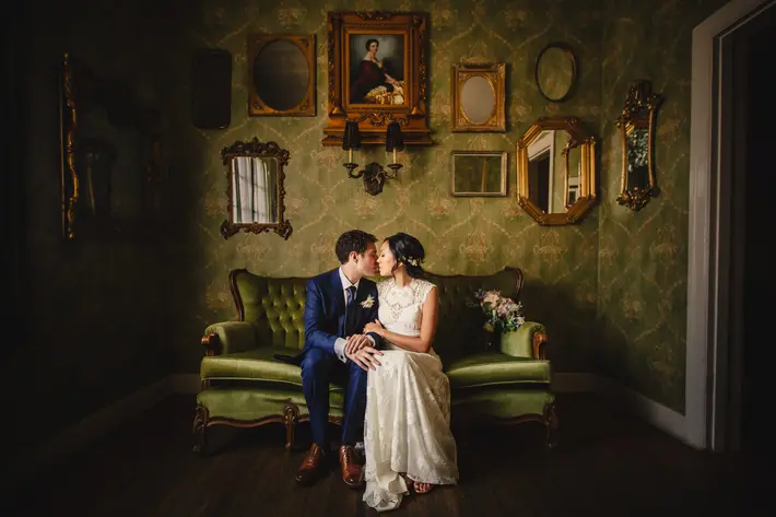 the-ebell-club-couple-kiss-in-antique-room-m-hart-los-angeles-photographer