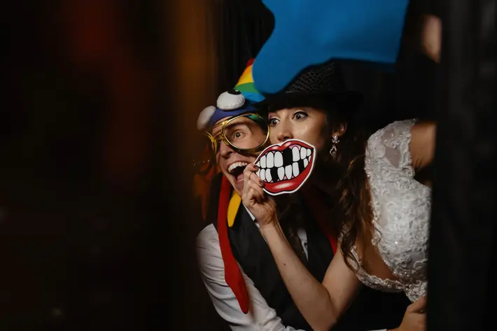 bride-and-groom-having-fun-in-the-photobooth-new-orleans-austin-houston-photo-by-dark-roux